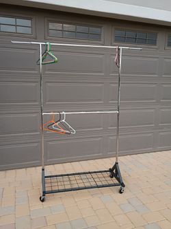 Clothes rack high and low 38-in center with 12-in extensions and both sides and tray on the bottom. Very stable Cash only please