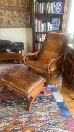 Leather and wood chair and footrest