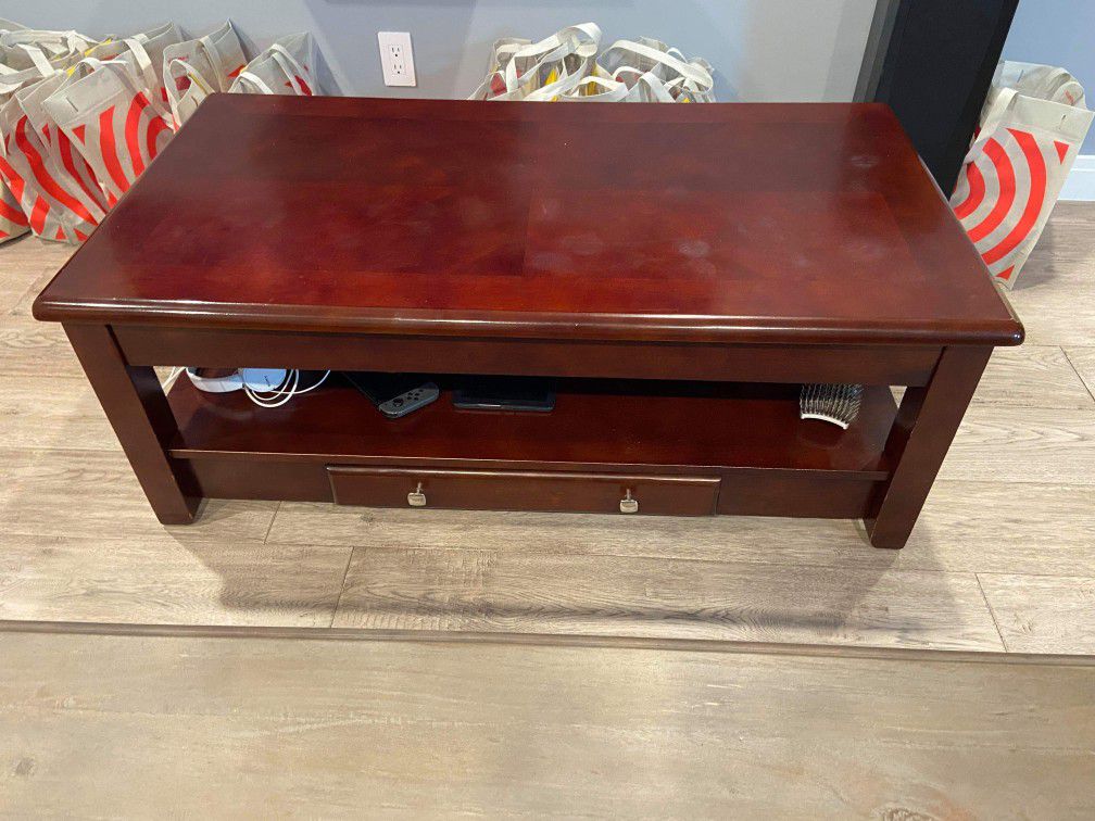 Mahogany finish coffee table with drawer and under storage