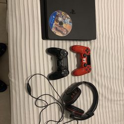 Black Ps4 with 2 controllers, headset, and gta