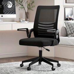 ergonomic or task chair, commonly used in offices or home workspaces