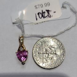 10k gold charm with heart shapped cz .8 grams