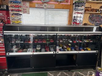 Glass display case $550.00 or best offer cars are not included