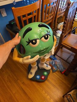Green M&M promo candy stand