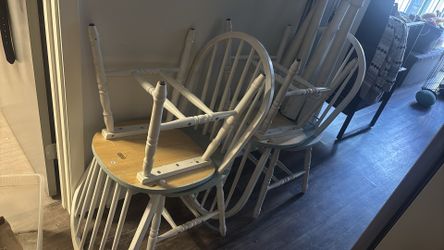 Four kitchen table chairs in really good shape with a kitchen table