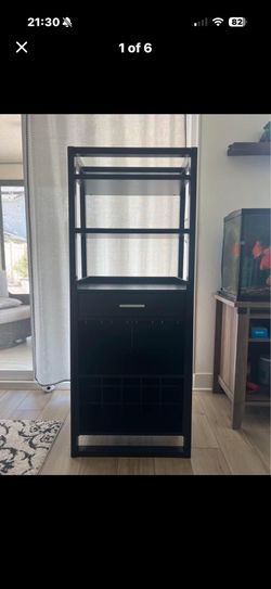Nice wine cabinet, dark brown color, Three layers for display One draw And one lay for glasses One lay for wine