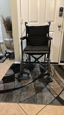 Lightweight Transport Wheelchair with 2 removable foot rests and gel padded seat cushion