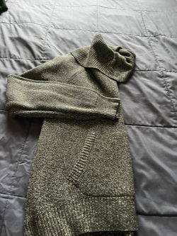 It’s Very Good Holiday Sweater In Size Medium. The Color Is Dark Gray With Sparkling On It. It’s For Women’s Made By NY& Company