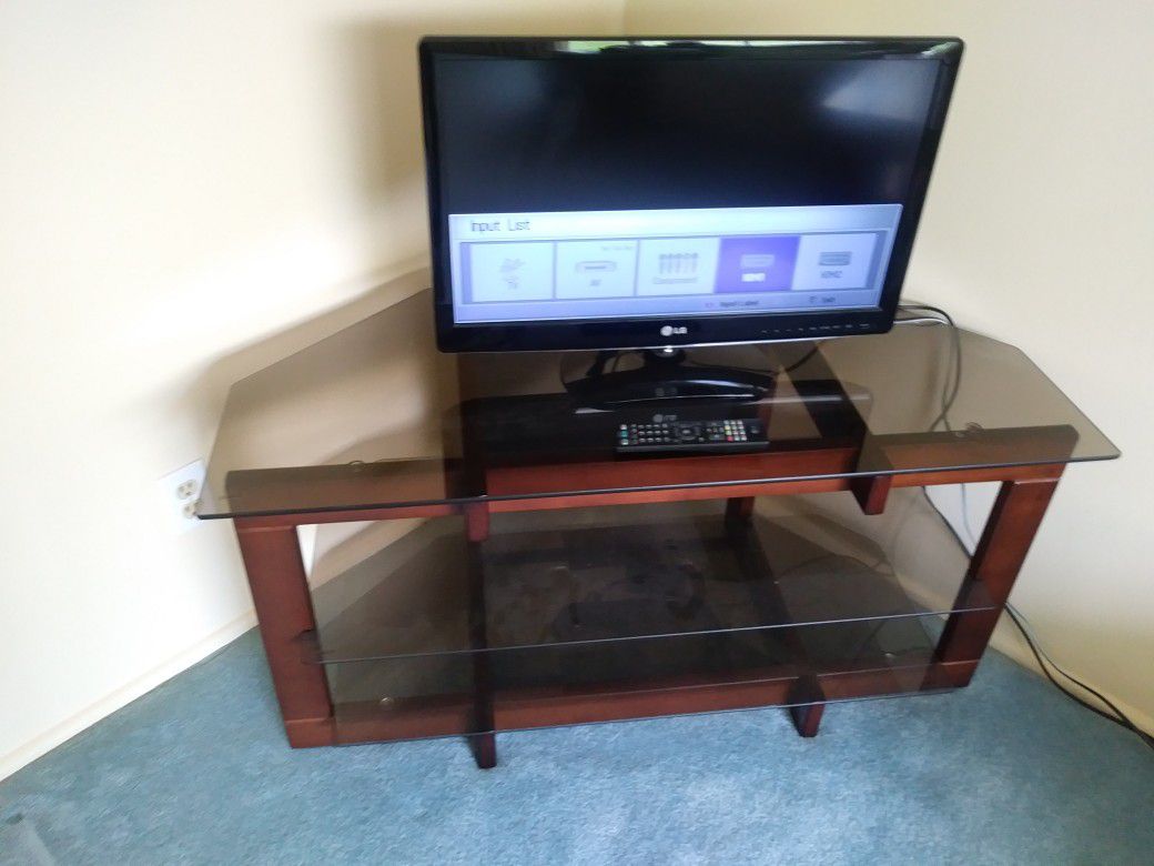 Samsung flat screen TV with remote OR 3 tier black tint TV stand for sale