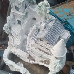 fiber glass castle about 2 ft tall