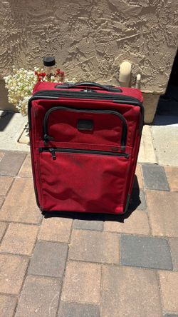Red  21 inches Tumi suitcase
