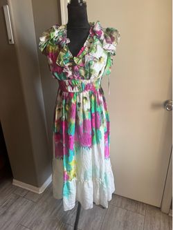 Maison Tara floral dress with ruffles in size 8. Pink, green, and white floral print with ruffled sleeves and hem. #floraldress #ruffles Size 8 brand 
