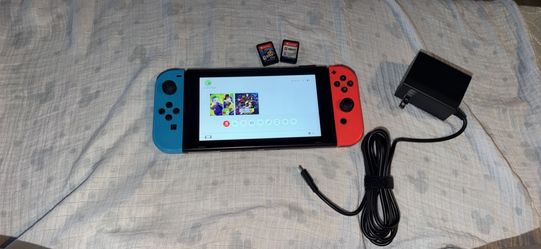 Nintendo switch with two games and charger. No docking station. No trades cash only. No Zelle, cashapp, Venmo or PayPal  check my other listings for m