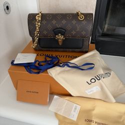 Authentic Louis Vuitton Victorie Bag. 