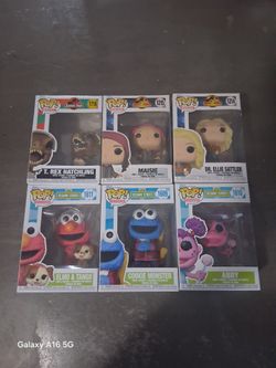 6 Funko Pops!, 3 jurrasic, and 3 sesame street