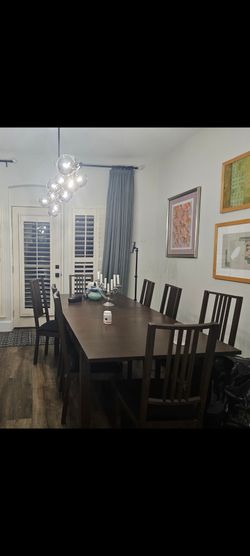 8 chair dinning table in like new conditions with 2 slabs