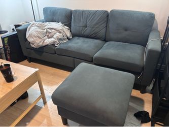 Couch with sectional cushions and movable ottoman