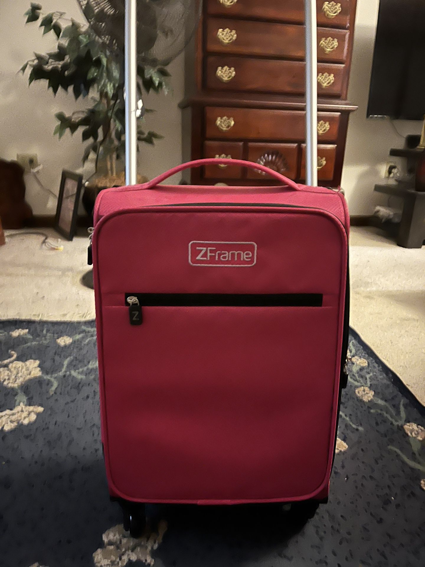 Small Pink Rolling Suitcase 
