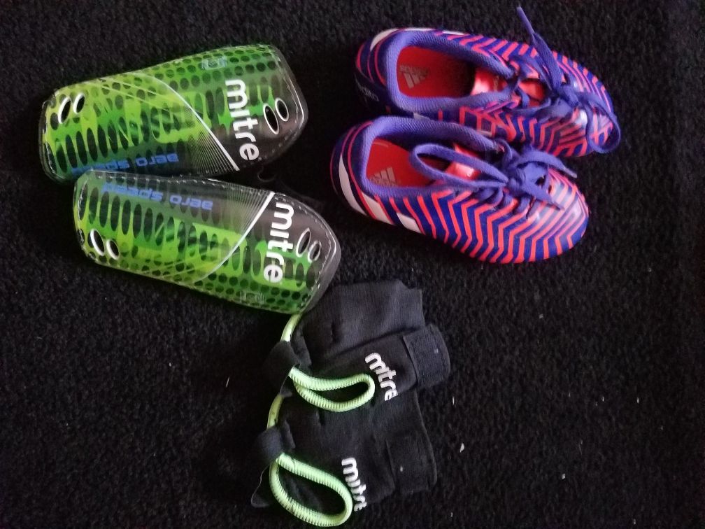 Soccer cleats (kids size 12) and guards