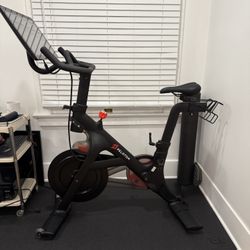 Peloton Exercise Bike and Floor Mat