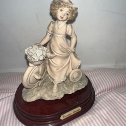 Giuseppe Armani Florence “ Girl on a Tricycle with a Basket of Flowers” Figurine