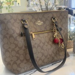 Coach Large Bag with Cherry Charm  Beautiful large-size Coach bag, spacious and stylish. Comes with an adorable Coach cherry charm that adds a playful