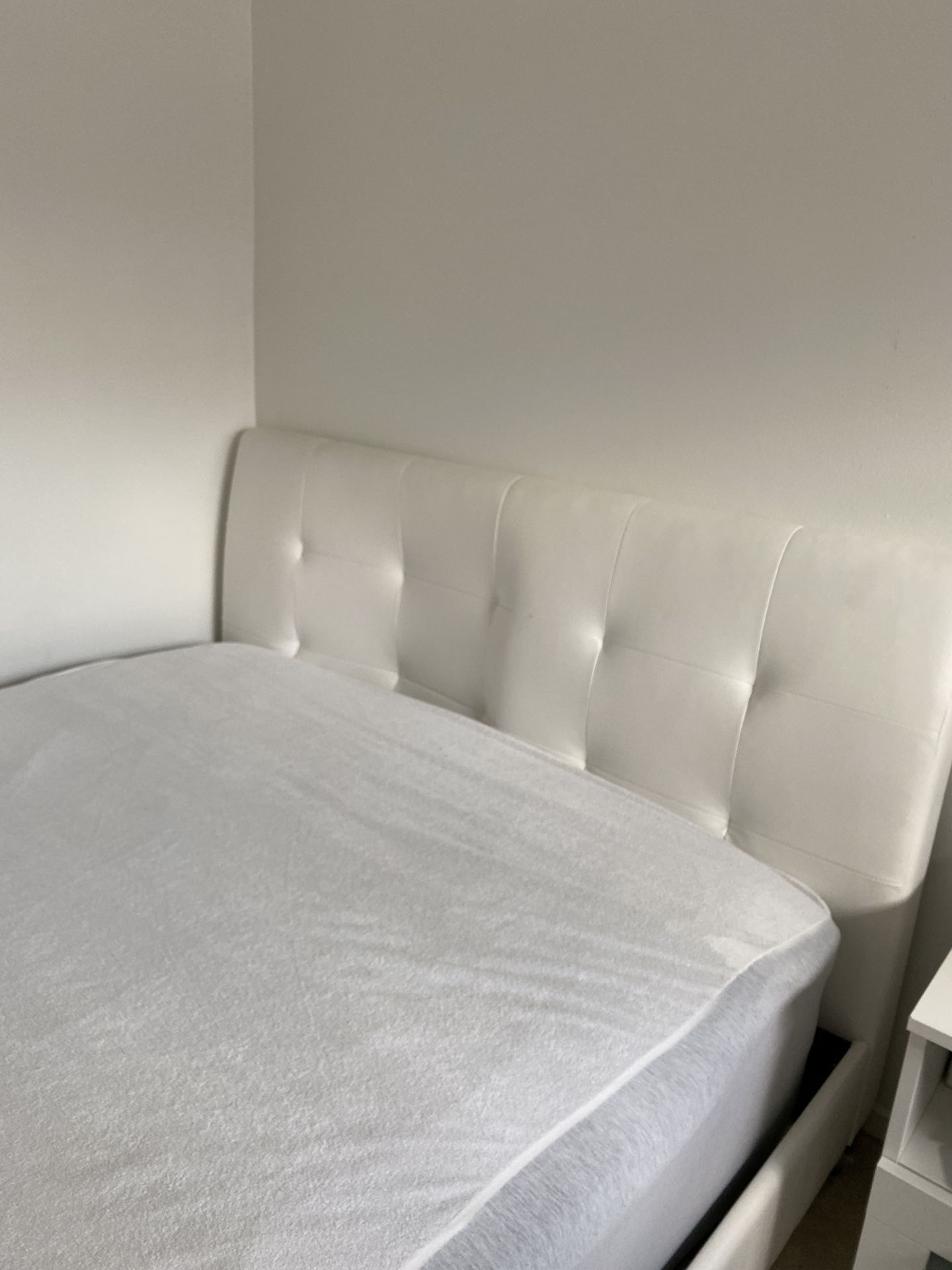 White leather bed and white desk with two mirror