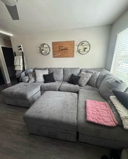 Ashley furniture grey sectional with storage ottoman
