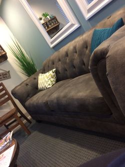 Two Ashley furniture gray sectional couches