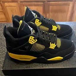 Black And Yellow Jordan 4’s