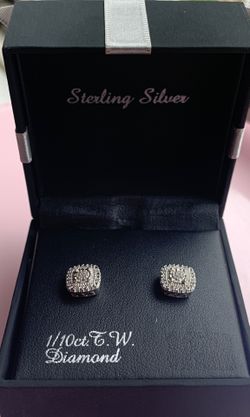 Brand new never used 1/10ct. Sterling silver earrings