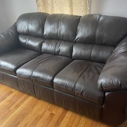 The three of them sat on the sofa.