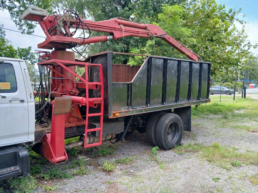 Grapple truck body dump. Tree Work Etc.