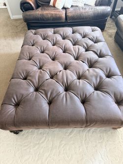 Brown ottoman.