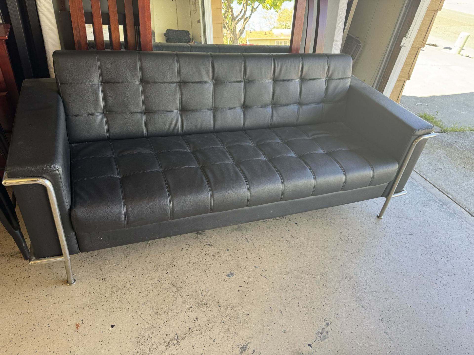 Black leather Couch. Great quality.