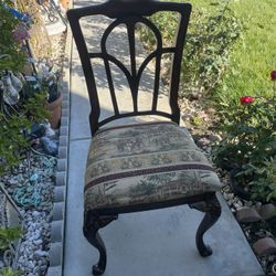 Two Wood Chairs With Attached Cushion