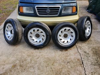 Suzuki Sidekick Geo Tracker Oem Wheels  5x5.5  Set 4 New Tires