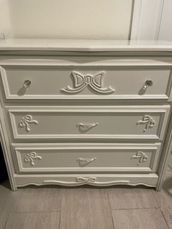 White dresser with bowties