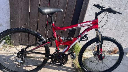 Red Avigo dual suspension Mountain bike , 26” tire size