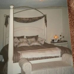 King Size Bed With 4 Post Wrought Iron Criss Cross Canopy . 2 Night Stands With Marble Tops Dresser With Tri Fold Mirrors...EXCELLENT Condition..