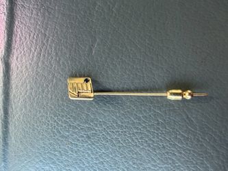 14 karat gold stick pin with .25 karat natural deep blue sapphire