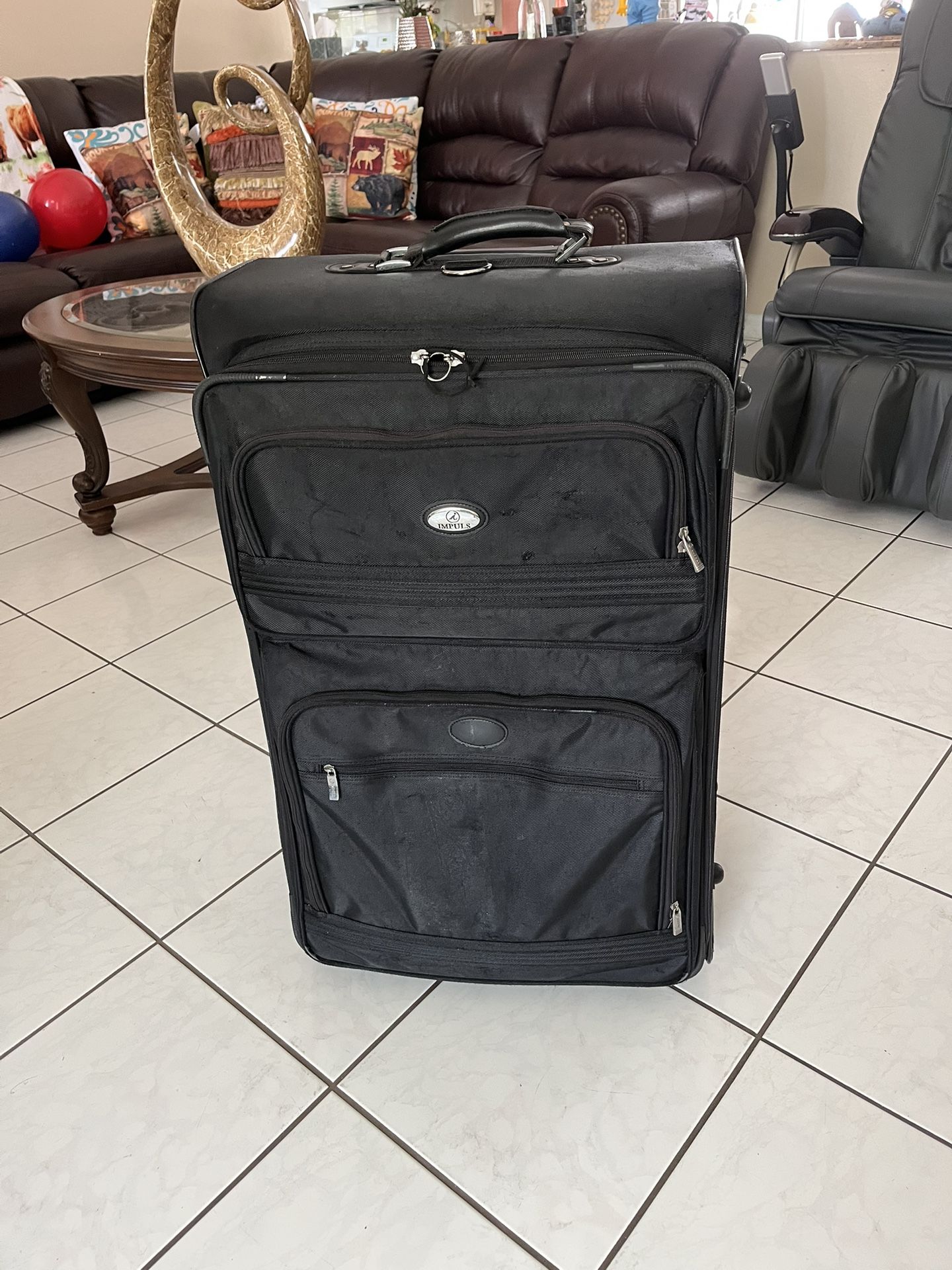 Large two-wheeled suitcase in good condition and clean, measuring 32 inches high, 14 inches wide, and 12 inches deep.