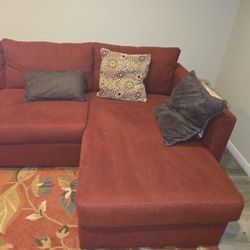 Dark Red Couch With Stretch Out Stool