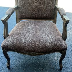large oversized upholstered leopard print chair . Has sone scratches from use - see pics 