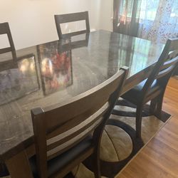 A Table And 4 Chairs 