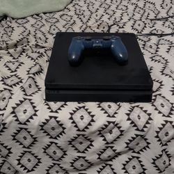 PS4 with a blue controller
