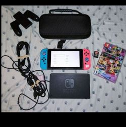 Nintendo switch bundle with brand new joycons. 2 games and 64gb Microsd card.