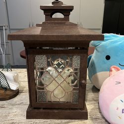 large candle holder with the candle (iron very heavy duty)