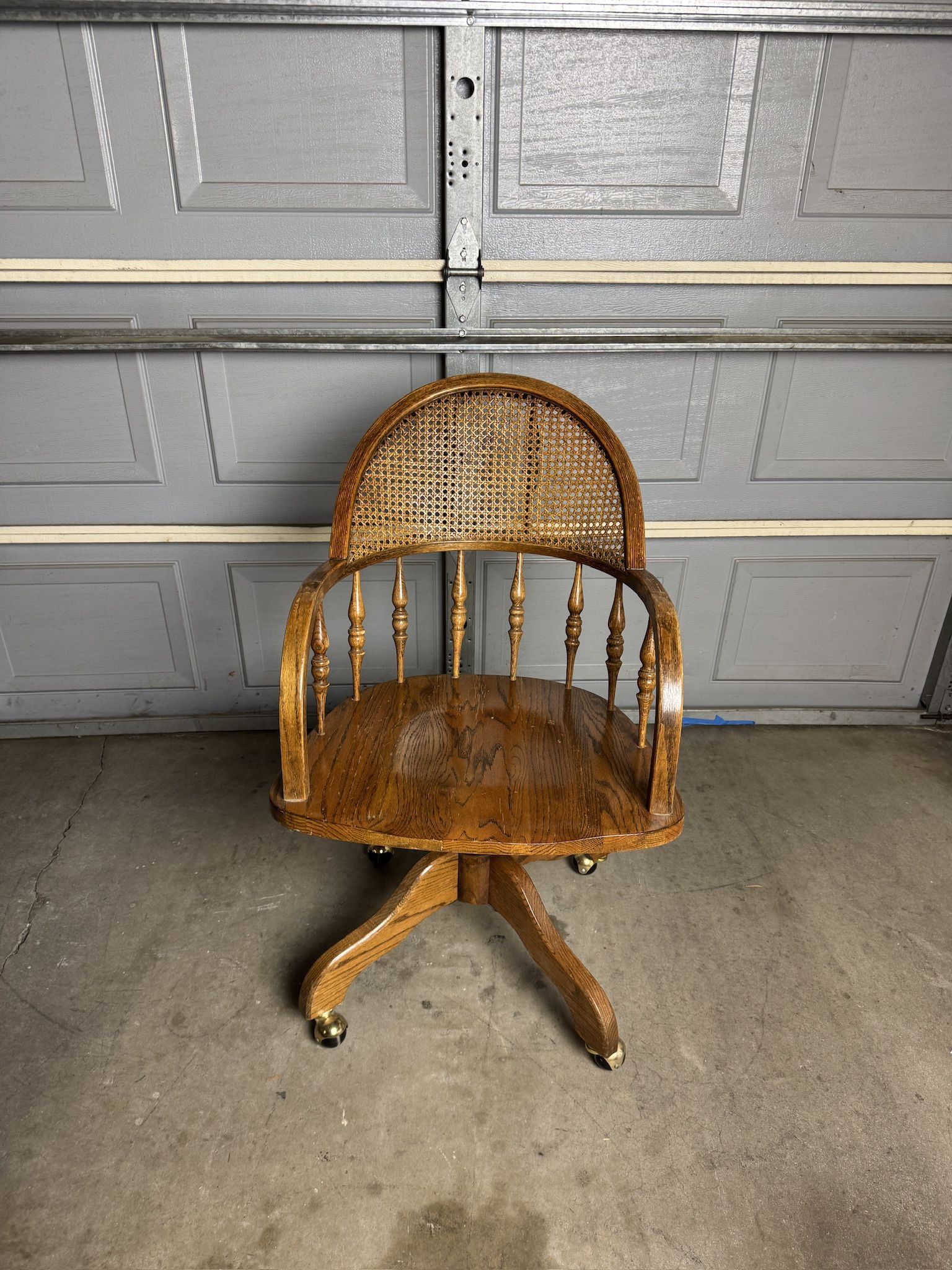 Cane Backed Oak Bankers Roller Chair w/ padded seat