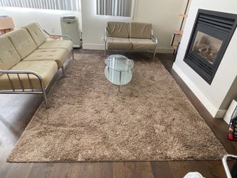 Brown rug 7.5’ x 10’
